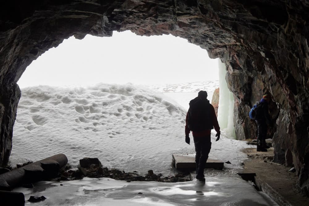 Hikers at the entrance of WWII torpedo battery