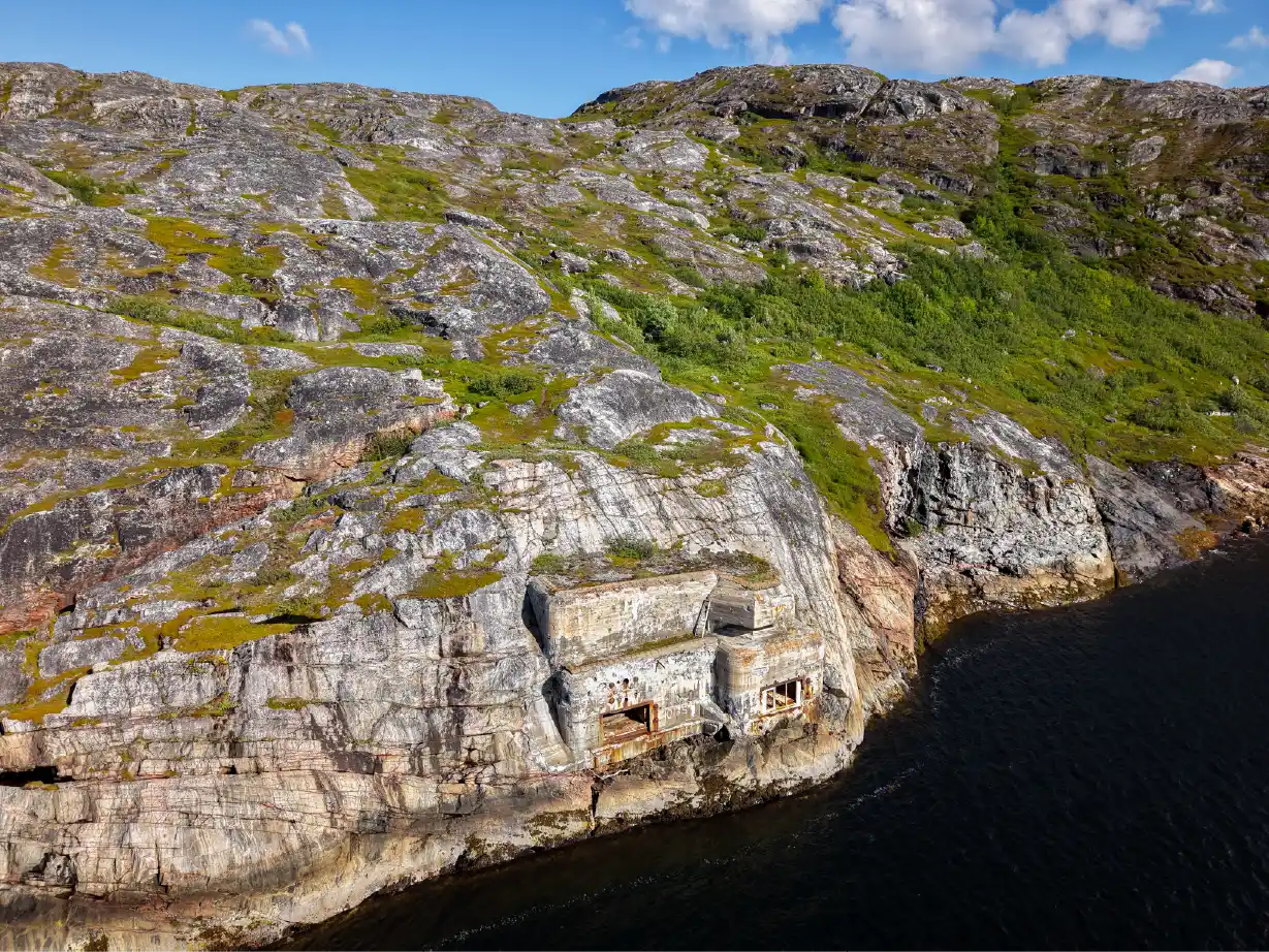 WWII torpedo battery built into the rocky coastline near Kirkenes in Northern Norway.