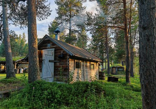 Traditional Norwegian wood-stove sauna in the forest of Arctic Norway